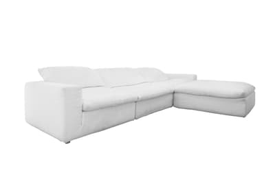 A sectional sofa with a chaise lounge extension, upholstered in white fabric. The sofa features multiple seat cushions and back cushions, with a slightly relaxed, slipcovered appearance. — 3D model