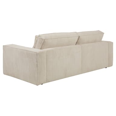 A contemporary three-seater sofa upholstered in a cream or beige corduroy fabric, featuring broad, plush cushions and block arms. The sofa has a minimalist design with visible seam piping. — 3D model