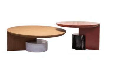 A set of two modern, geometrically designed tables featuring contrasting materials and colors. The larger table has a light wood round top, dark wood base, and light gray cylindrical concrete support. The smaller table has a red lacquered round top and matching red lacquered base, with a black marble cylindrical support. — 3D model