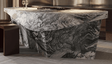 A long, contemporary reception desk crafted entirely from highly veined marble, featuring an irregular, faceted base and a subtly contoured top surface, designed for a modern aesthetic. — 3D model