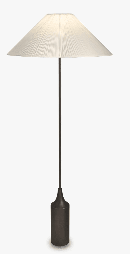 A floor lamp with a pleated, conical lampshade and a dark, cylindrical base. The lamp has a slender central pole connecting the base to the shade. The lampshade is made of a fabric material and is illuminated from within, casting a warm glow. — 3D model
