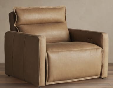 A contemporary recliner armchair upholstered in a tan or camel-colored leather, featuring thick cushioning, square-profile arms, and visible topstitching. — 3D model