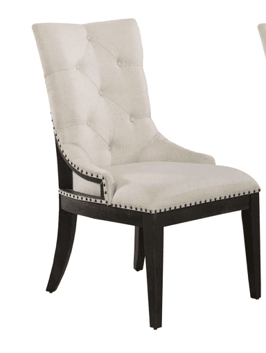 A high-backed armchair with tufted upholstery and nailhead trim. The frame appears to be dark wood, contrasting with the light-colored fabric. — 3D model