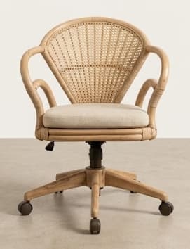 A light-colored, woven cane desk chair with a curved backrest and armrests. It features a padded seat cushion and a five-star base with casters for mobility. The chair appears to have a height adjustment mechanism. — 3D model