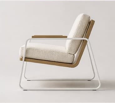 A modern armchair featuring a tubular metal frame in white, supporting a seat and back cushion upholstered in a textured, off-white fabric. The armrests are capped with light-colored wood, and the base incorporates curved wooden elements. — 3D model
