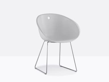 A white molded shell lounge chair with a minimalist chrome-plated wire sled base. — 3D model