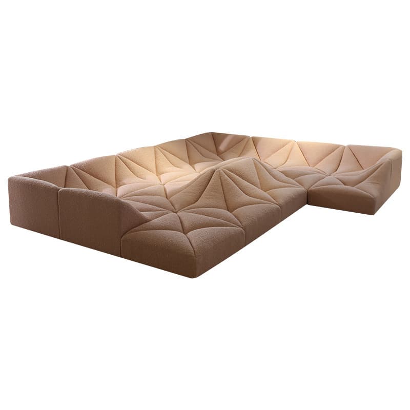 A contemporary modular sectional sofa featuring a low-profile design and distinctive geometric tufting. The sofa is upholstered in a textured, light brown or beige fabric, with individual modules forming an L-shaped configuration. The intricate tufting creates a faceted, three-dimensional surface across the seating and backrest areas, giving it a sculptural appearance. The design emphasizes comfort and a relaxed lounging experience, suitable for modern living spaces. — 3D model