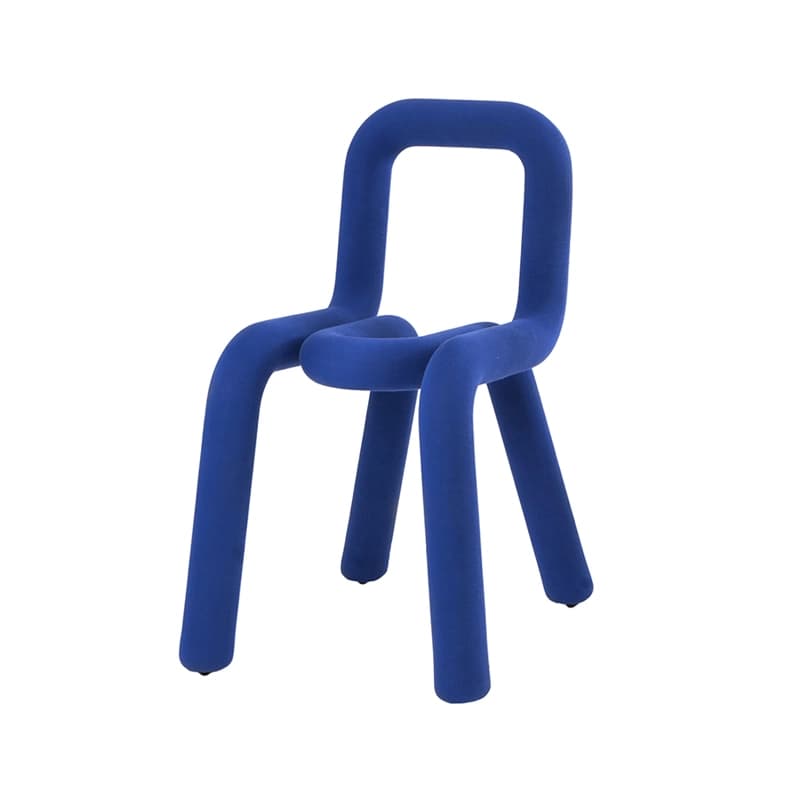 A modern, sculptural chair with a tubular, continuous form, upholstered in bright cobalt blue velvet or similar soft fabric. — 3D model