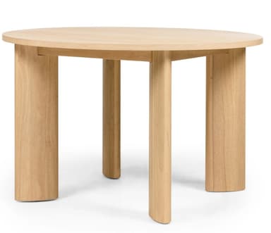 A round dining table crafted from light-toned wood, featuring a circular tabletop supported by four thick, sculptural legs. The legs have a unique curved profile, presenting a minimalist and contemporary aesthetic. The natural wood grain is visible throughout, indicating a solid wood construction or high-quality veneer. — 3D model