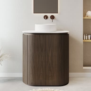 A cylindrical accent table featuring a dark brown, vertically fluted body and a smooth, contrasting white circular top. A white, ridged bowl-like object is placed on the table's surface. — 3D model