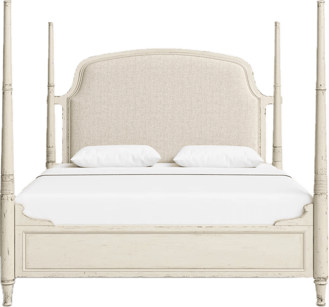 A cream-colored four-poster bed featuring an upholstered headboard and a distressed finish. The bed frame includes four tall, turned posts and a low footboard with a gently scrolled design. The headboard is rectangular with a subtly curved top, upholstered in a light, textured fabric. The overall aesthetic suggests a blend of traditional and shabby chic styles. — 3D model