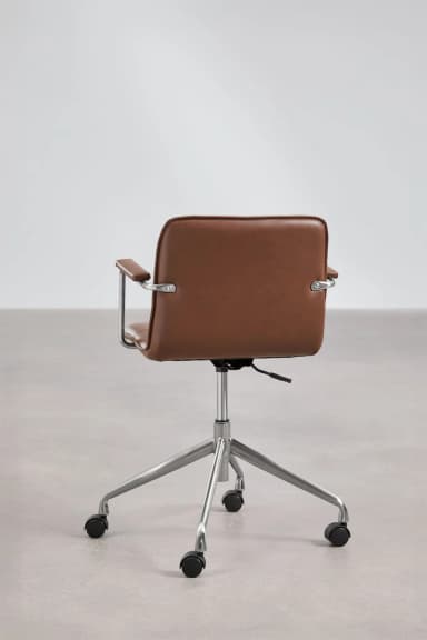 A modern office chair with a low-back design, featuring a brown leather seat and backrest, supported by a polished metal frame and a five-star base with casters. The armrests are also made of polished metal with brown leather pads. — 3D model