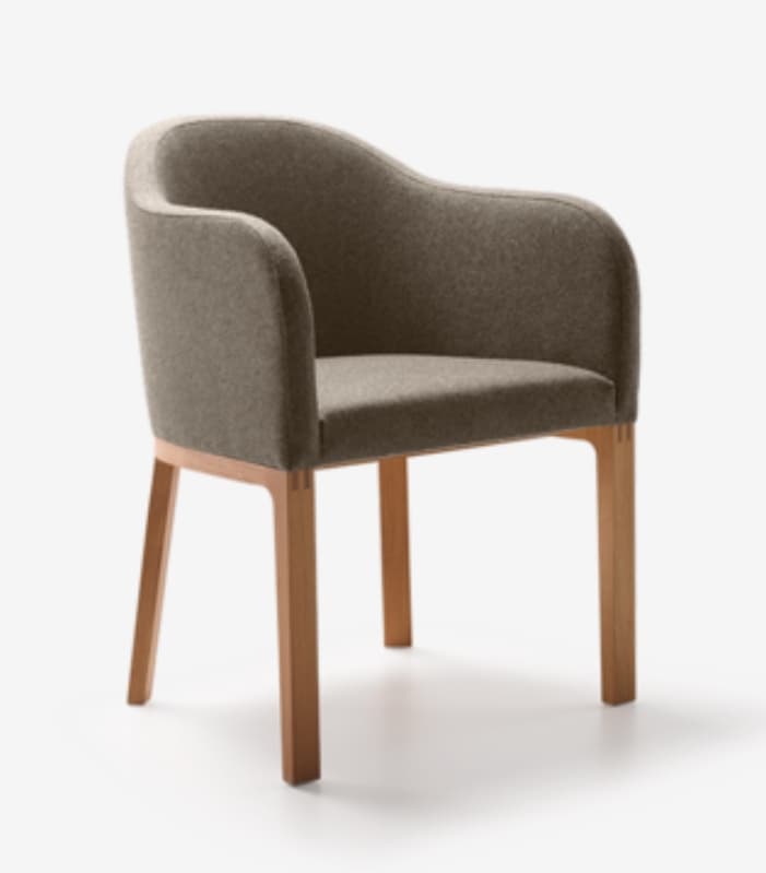 A modern armchair with a curved, upholstered back and seat, supported by four wooden legs. The upholstery has a textured finish, and the wooden frame appears to be made of light-colored wood. — 3D model