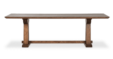 A long, rectangular wooden table with a sturdy, thick top and two trestle-style bases connected by a central stretcher. The wood has a visible grain and a dark, rich brown finish, suggesting a rustic or farmhouse aesthetic. The bases feature broad, vertical supports and wide, horizontal feet, providing a stable foundation. — 3D model