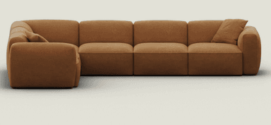 An L-shaped, modular sectional sofa upholstered in a warm camel brown microsuede-like fabric. The sofa features a soft, rounded profile with plush, integrated seat and back cushions. It consists of multiple segments, including corner and armrest pieces, creating a cohesive, inviting seating arrangement. The design is low-slung and minimalist, emphasizing comfort. — 3D model
