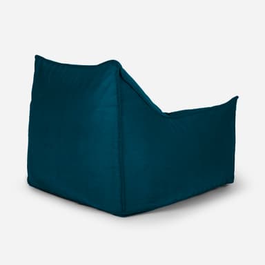 A teal-colored bean bag chair with a structured, armchair-like design. It features a high backrest, integrated armrests, and a deep seat, all upholstered in a soft, textured fabric. The chair appears to be filled with loose material, allowing it to conform to the user's body. A small red tag with white lettering is visible on the upper right side of the backrest. — 3D model