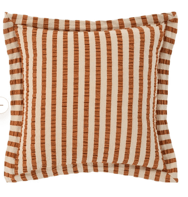 A square decorative throw pillow featuring a prominent vertical striped pattern in alternating shades of cream/beige and a warm rust/terracotta color. The fabric has a visible woven texture, giving it a tactile quality. The pillow is finished with a flanged edge, where the fabric extends beyond the main seam and is then sewn down, framing the central pattern. It appears to be new and in pristine condition, presented against a white background. — 3D model