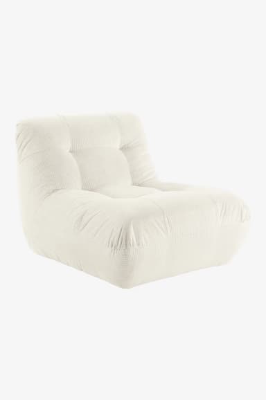 A low-profile armchair upholstered in cream-colored corduroy fabric. The armchair features a tufted backrest and seat, with plush, rounded armrests that seamlessly integrate into the base. The corduroy material exhibits distinct vertical ribbing, contributing to its textured appearance. The overall design is modular and contemporary, emphasizing comfort and a relaxed aesthetic. — 3D model
