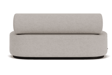 This is a modular lounge chair segment designed for flexible seating arrangements. It features a cylindrical backrest that sits atop a rounded, upholstered base. The overall form is soft and inviting, with clean lines and a neutral color palette. The base appears to be supported by a dark, low-profile plinth or frame, providing a subtle contrast to the light upholstery. — 3D model
