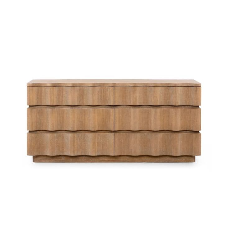 A dresser with six drawers arranged in two columns and three rows. The dresser features a scalloped or wavy design on the front of each drawer, creating a dynamic visual texture. The piece is supported by a low-profile base that also incorporates the scalloped design element. The top surface is flat and continuous. — 3D model