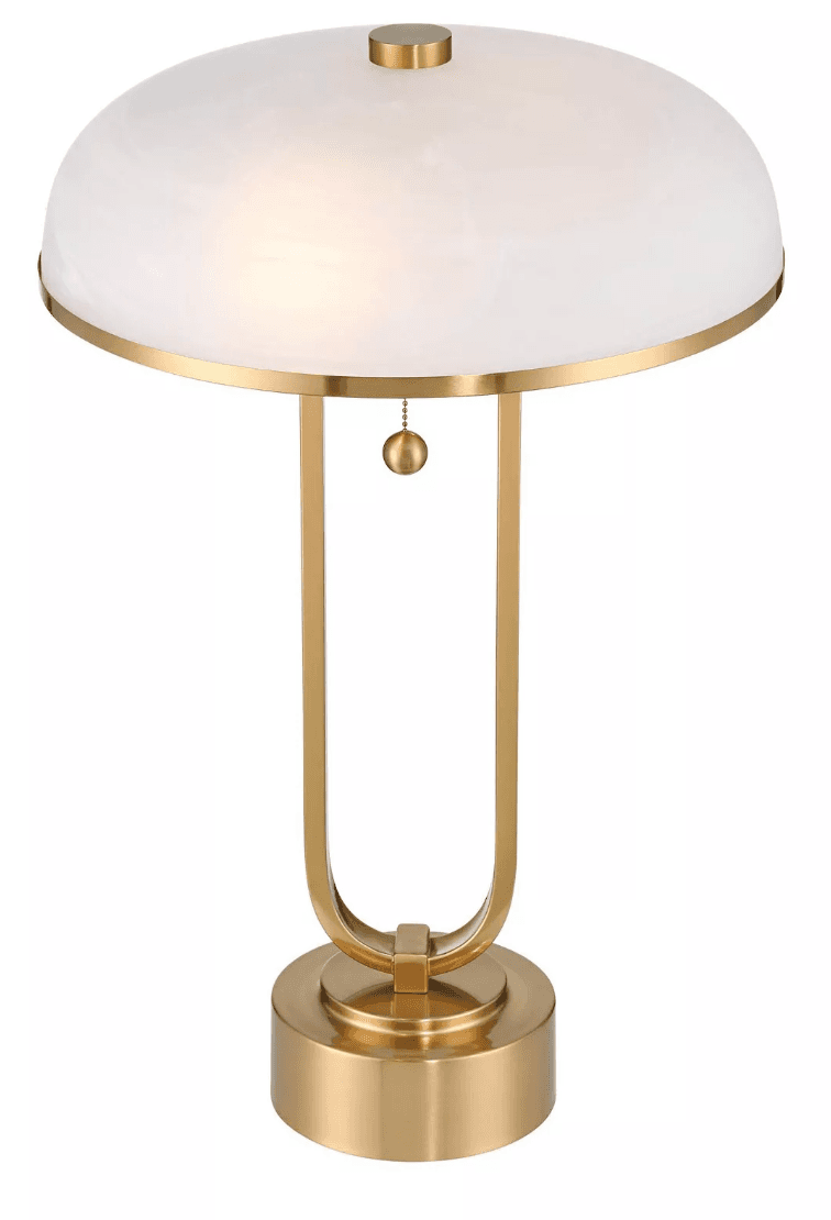 A table lamp with a rounded, white opaque shade and a gold-toned metal base and frame. The shade is trimmed with a gold band. The frame consists of two U-shaped supports originating from a circular base, connected at the top by a horizontal piece from which a beaded pull chain with a small spherical finial hangs. — 3D model