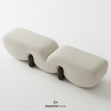 A modern, sculptural bench featuring a wavy, organic form, upholstered in light-colored boucle fabric, and supported by dark cylindrical wooden legs. — 3D model