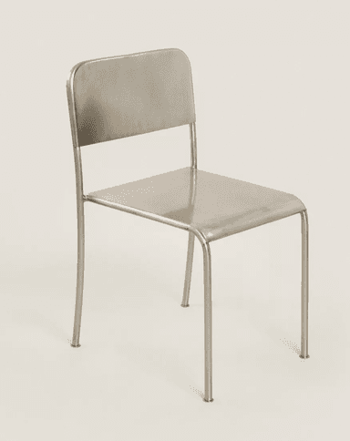A minimalist, modern armless chair constructed entirely from metal, featuring a tubular frame, a flat rectangular seat, and a slightly curved rectangular backrest. All edges are rounded, and the chair has a uniform metallic finish. — 3D model
