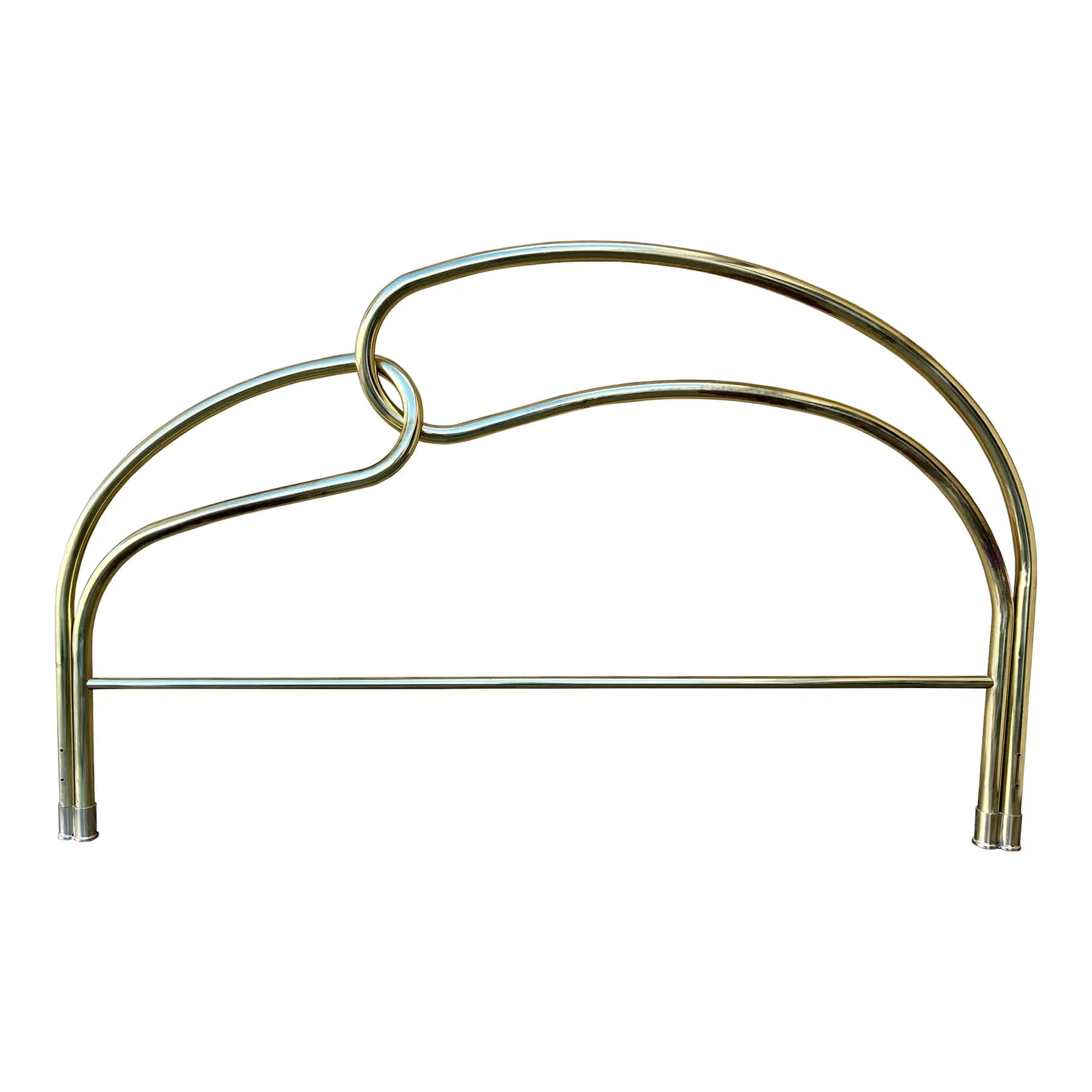 A polished metal headboard with a curved design. The headboard features two parallel horizontal bars supporting an arched top section. The arched section is formed by two tubular elements that loop and interlock in the center, creating a symmetrical, modern aesthetic. The vertical supports at each end are cylindrical, with visible fasteners or adjustment points at the base. — 3D model