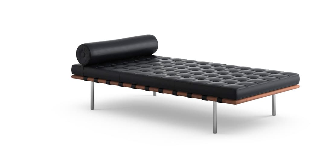 A classic modern daybed featuring black tufted leather upholstery, a cylindrical bolster pillow, and an exposed wooden frame with leather strapping. The frame rests on polished metal legs, presenting a minimalist and elegant design. — 3D model