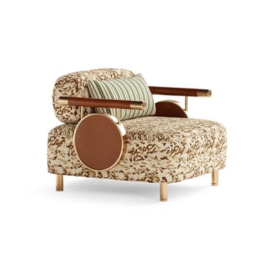 An avant-garde accent armchair featuring a patterned fabric upholstery in shades of beige and brown, lending an eclectic and luxurious aesthetic. The chair incorporates unique armrests made of polished brass rods wrapped with brown leather, which extend to support a circular, integrated side table on one side, also finished in brown leather and framed in brass. It is supported by four slender, tapered brass legs, suggesting a modern yet opulent design. — 3D model