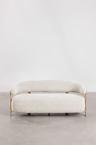 A contemporary sofa with a curved, organic shape. It features a thick, upholstered seat and backrest with rounded edges. The frame is partially exposed, with light-colored wooden legs and armrest supports that extend upward. The upholstery appears to be a textured fabric. — 3D model