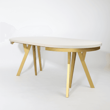 An oval-shaped dining table with a cream-colored top and a metallic gold base. The table top appears to be segmented, suggesting it might be extendable. The base consists of two angled, V-shaped legs that meet in the center, providing a modern and somewhat sculptural aesthetic. — 3D model