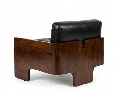 A Mid-Century Modern style armchair featuring a solid, dark wood frame and plush black leather upholstery. — 3D model
