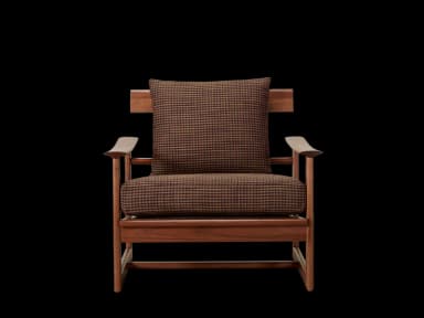 A wooden armchair with upholstered cushions. The frame is constructed from dark wood, likely walnut or a similar hardwood, featuring clean lines and a minimalist design. The seat and back cushions are upholstered in a patterned fabric, appearing to be a houndstooth or similar small-scale check in brown and black tones. The arms are curved and integrated into the wooden frame. — 3D model