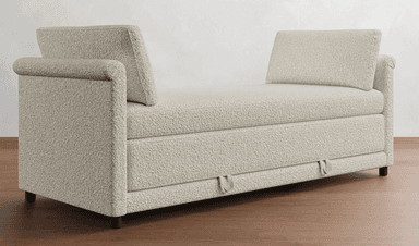 A light-colored sofa bed with a textured fabric upholstery. It features a streamlined design with a low profile, rolled arms on one side, and two distinct back cushions. The front of the sofa shows two pull handles, indicating its function as a sofa bed. — 3D model