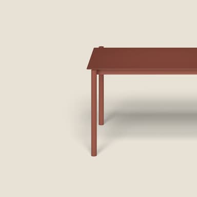 A minimalist, rectangular table with a solid, matte red-brown finish. It features a flat tabletop supported by four straight, slender legs positioned at each corner. The design is clean and contemporary, suggesting versatility for various settings. — 3D model