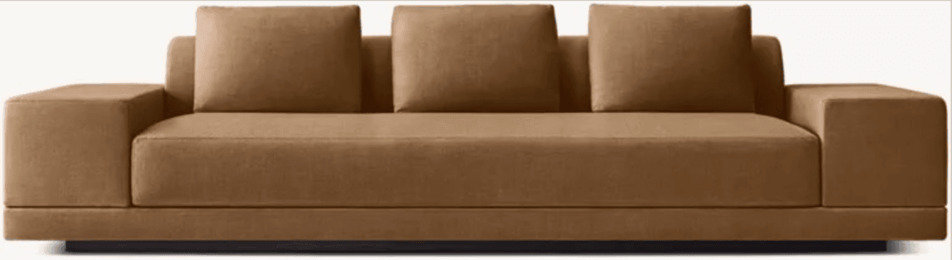 A contemporary sofa with a low profile and clean lines, featuring a unified base and three plush back cushions. The sofa has a right-arm facing chaise or extended seating area. The upholstery appears to be a textured fabric. — 3D model