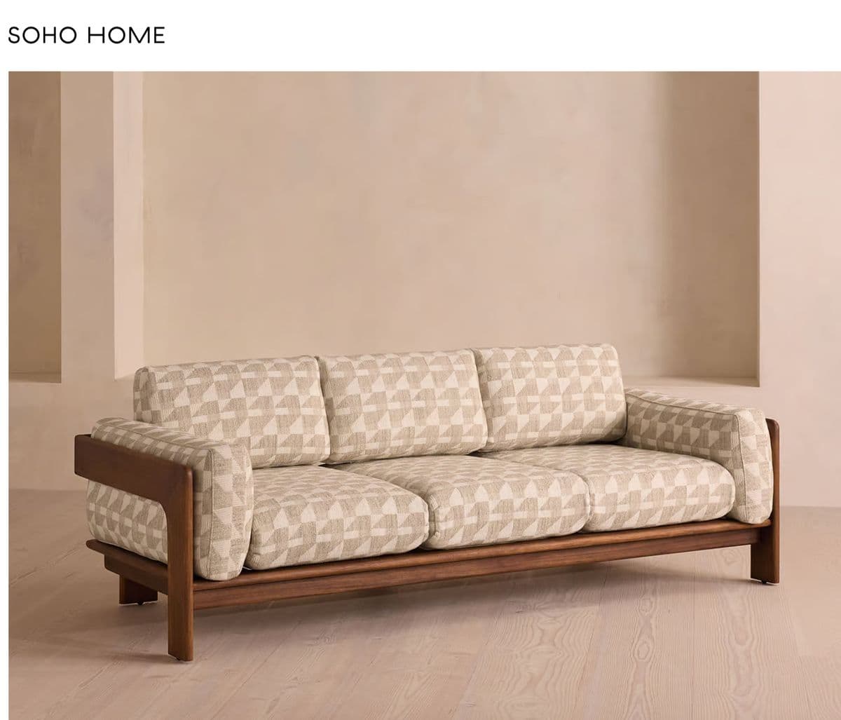 A mid-century modern style three-seater sofa featuring an exposed dark wood frame that forms the base, arms, and legs. It is upholstered in a light beige fabric with a geometric pattern. The sofa has three individual seat cushions and three matching back cushions, suggesting a comfortable and structured seating experience. — 3D model
