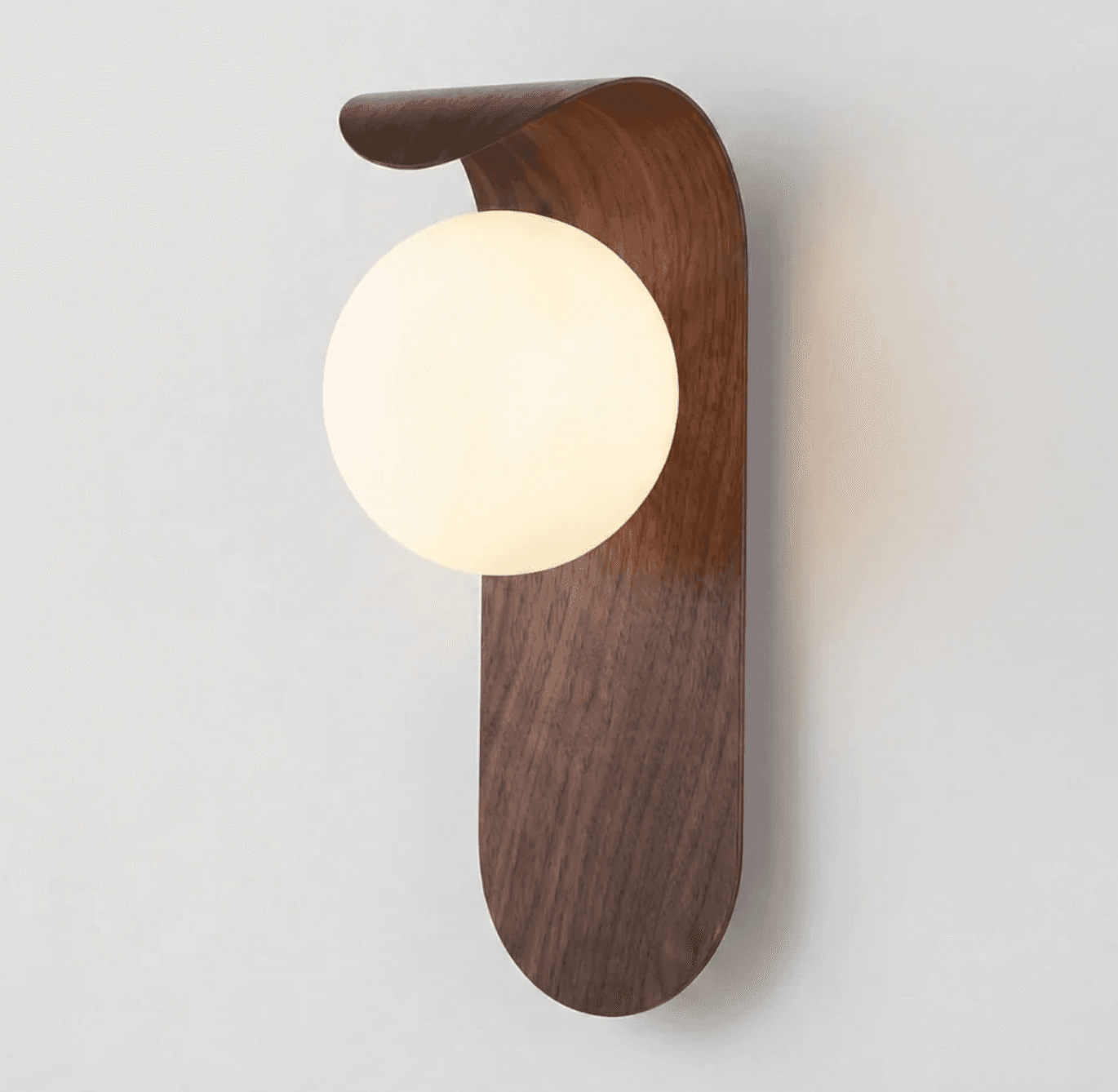 A modern wall-mounted lighting fixture featuring a dark wood backplate with a curved top section and a spherical, opal glass diffuser. — 3D model