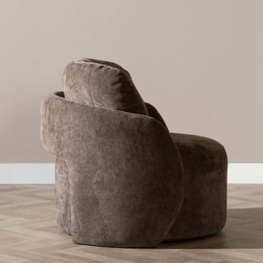 A contemporary upholstered lounge chair featuring a plush, rounded barrel silhouette in a taupe-brown textured fabric. The chair has integrated armrests and a thick, comfortable backrest, offering a cocoon-like seating experience. Its design emphasizes softness and comfort, suitable for modern living spaces. — 3D model
