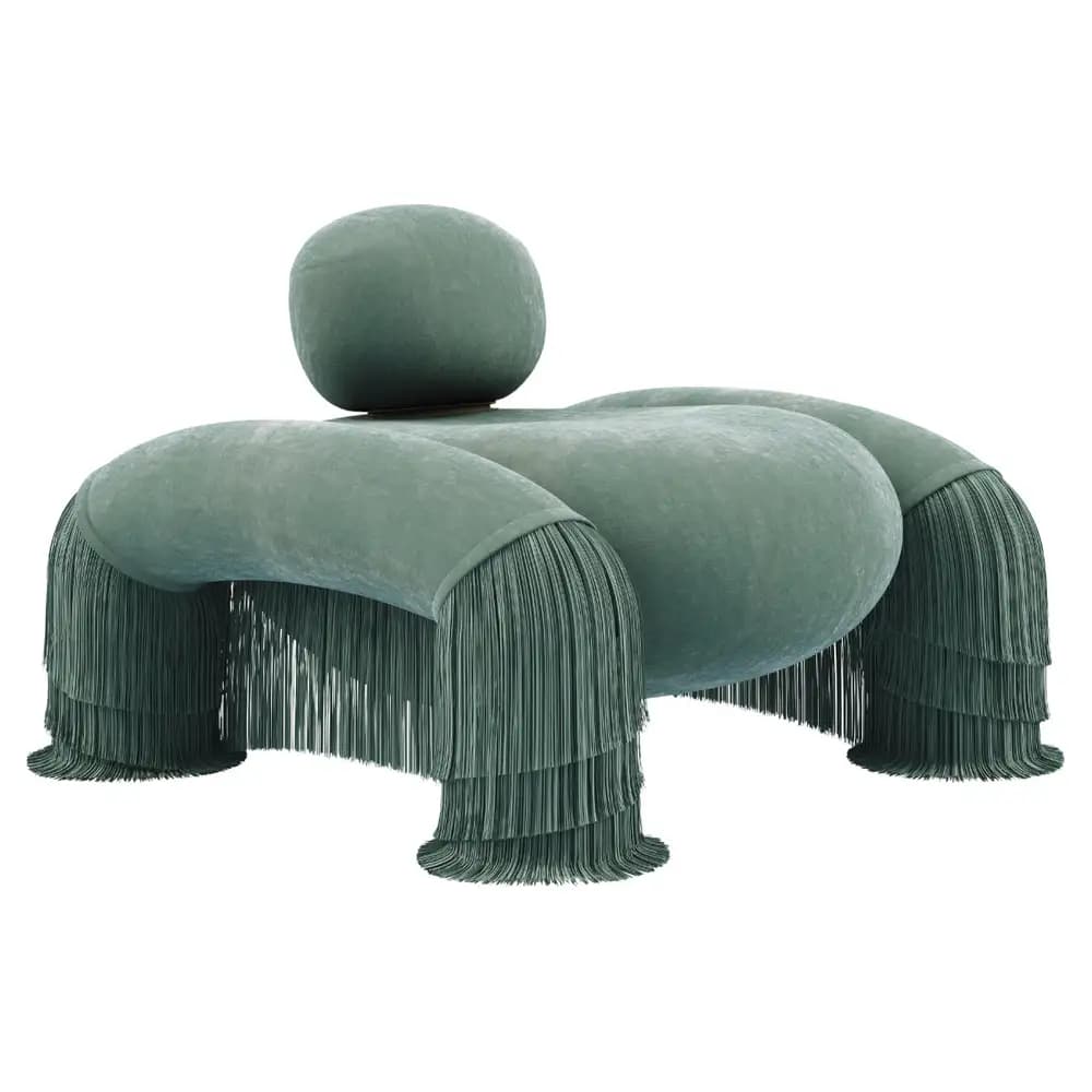 A highly stylized and sculptural lounge chair upholstered in a soft, plush greenish-blue velvet-like fabric, featuring prominent, multi-layered fringe tassels on its four rounded, stubby supports. It includes a separate, rounded backrest cushion that maintains the overall organic form. — 3D model