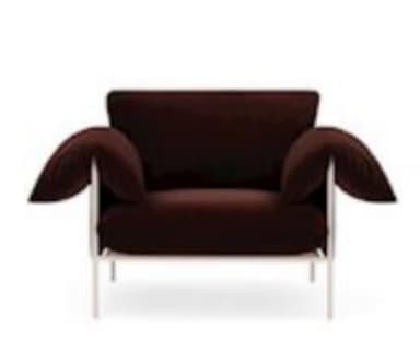 A modern lounge chair featuring a minimalist white metal frame and plush, dark brown fabric cushions. The chair includes a loose seat cushion, a rectangular back cushion, and two overstuffed, pillow-like armrests that drape over the frame. The design emphasizes comfort through its soft upholstery, contrasted with the clean lines of the exposed frame. — 3D model