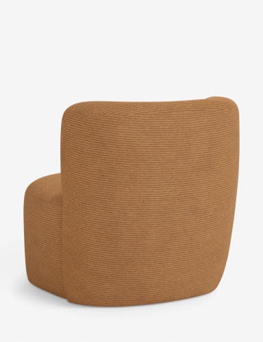 A low-profile, armless lounge chair fully upholstered in a textured, camel-brown knit fabric. It features a soft, rounded seat and an integrated, gently curved backrest, presenting a contemporary and organic aesthetic. The design emphasizes comfort and a monolithic, sculptural form. — 3D model