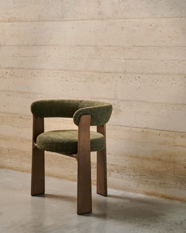 An upholstered dining armchair featuring a curved backrest and integrated armrests, supported by a solid wooden frame. — 3D model