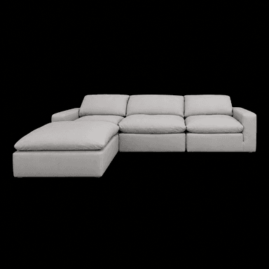 A modular sectional sofa with a chaise lounge extension. The sofa features a low profile, deep seating, and generously padded cushions for the back and seat. The chaise is positioned on the left side when facing the sofa. The upholstery appears to be a light-colored fabric or leather. — 3D model