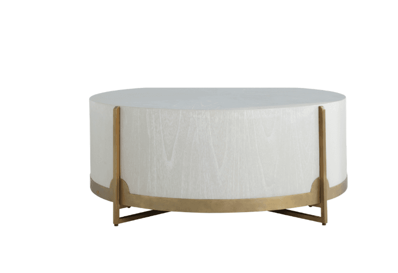 A modern, oval coffee table with a light wood-grain texture on the cylindrical base and a matte white top. It features a brushed brass metal band around the base and decorative brass metal supports that attach to the top. — 3D model