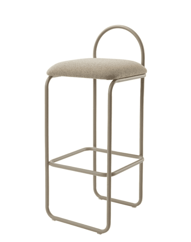 A contemporary bar stool featuring a tubular metal frame in a neutral taupe color and an upholstered, cushioned seat in a matching beige fabric. The design includes a minimalist curved backrest and a square footrest. — 3D model