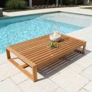 A low-profile rectangular table constructed from light-colored wood, featuring a slatted tabletop. The legs are robust, connected by horizontal stretchers, and the overall design suggests outdoor use due to its construction. — 3D model