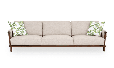 A three-seater sofa featuring a light beige fabric upholstery and an exposed dark-stained wooden frame. It includes three seat cushions, three back cushions, and two decorative pillows with a green botanical pattern. — 3D model