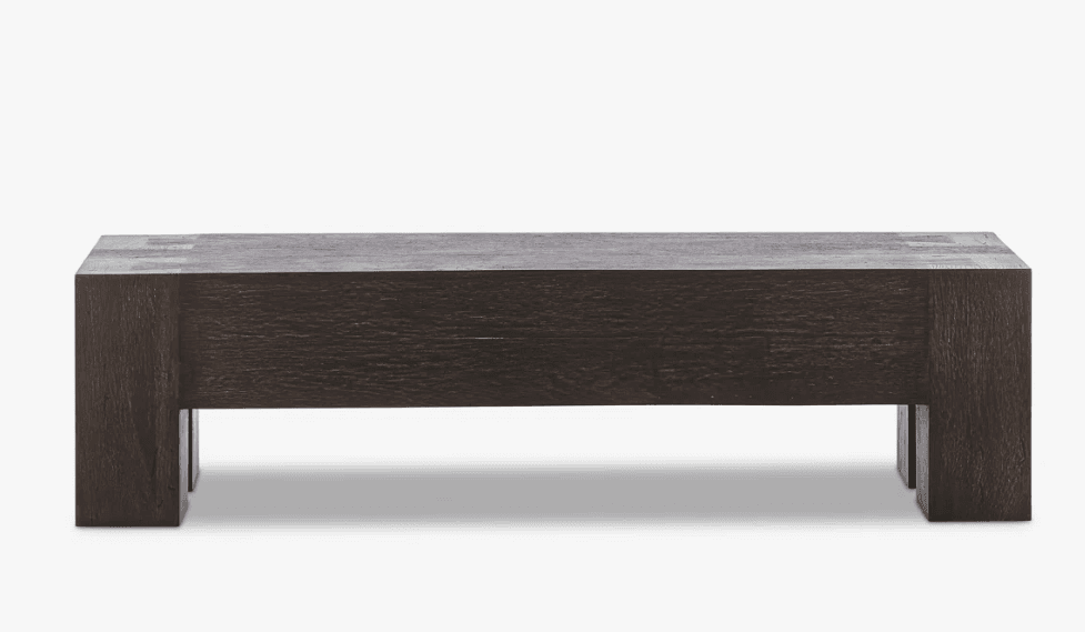 A dark brown, rectangular coffee table with a solid, block-like construction. The table features a thick, flat top supported by two substantial, rectangular legs on each side. The wood grain is visible, suggesting a natural material. The design appears minimalist and robust. — 3D model
